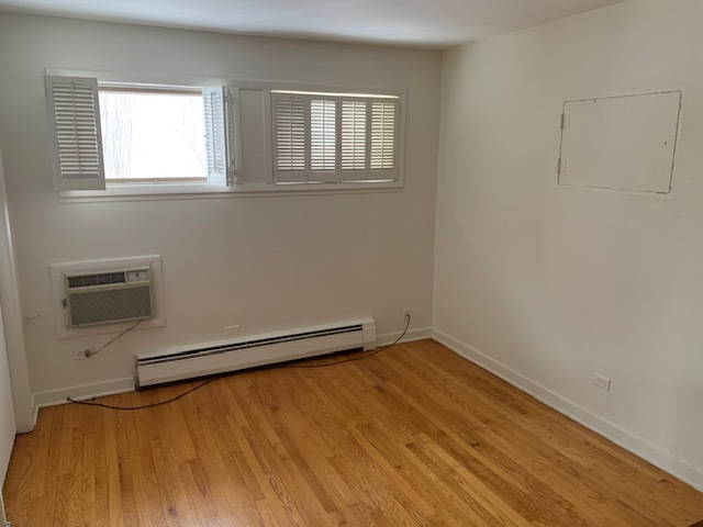 3008 Lincoln Road Oak Brook, IL 60523 - Photo 8 of 15 wooden floor in an empty room with a window