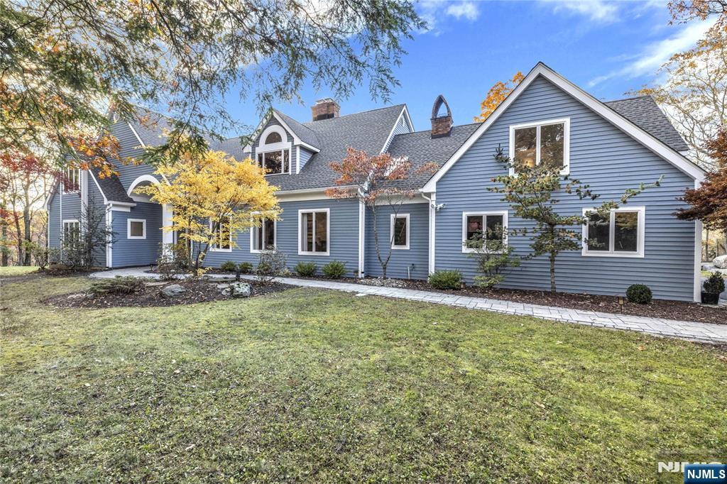 738 Ridge Road Butler, NJ 07405 - Photo 1 of 50 a view of a yard in front of house