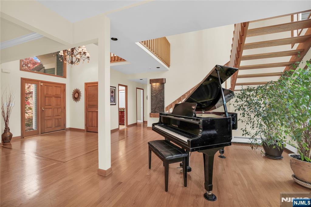 738 Ridge Road Butler, NJ 07405 - Photo 11 of 50 a living room with furniture and a piano