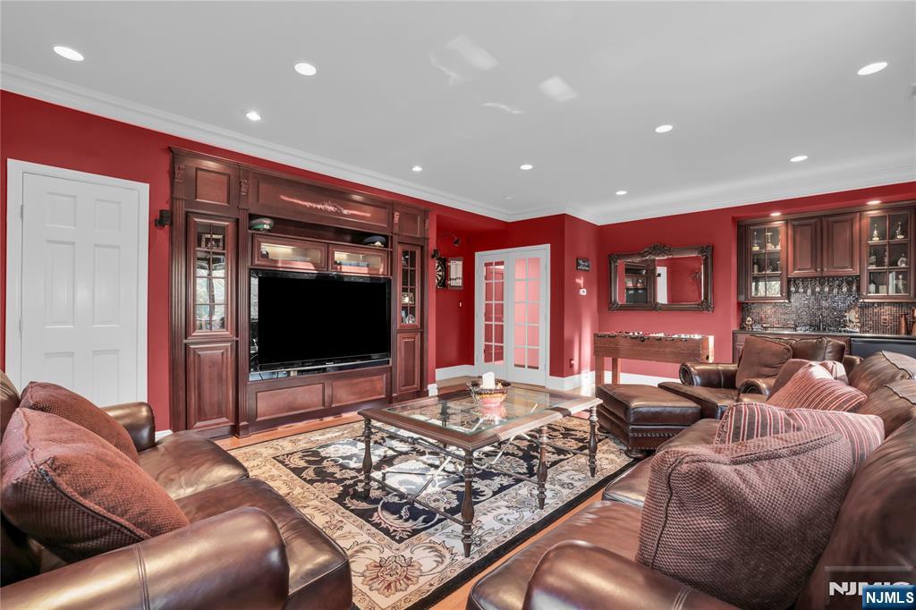 738 Ridge Road Butler, NJ 07405 - Photo 31 of 50 a living room with furniture and a flat screen tv