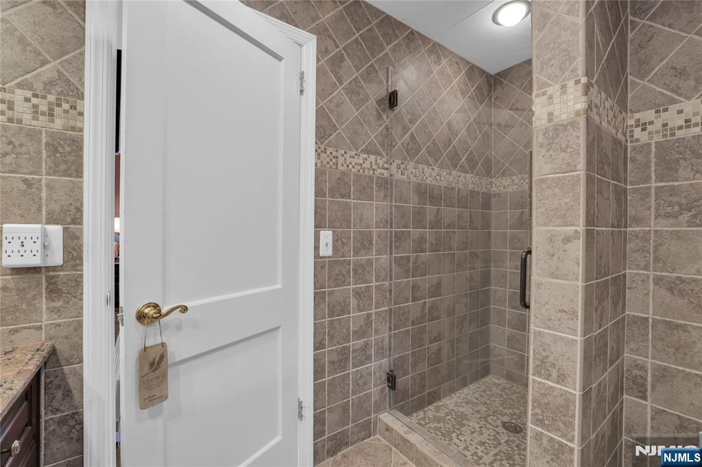 738 Ridge Road Butler, NJ 07405 - Photo 34 of 50 a bathroom with a shower