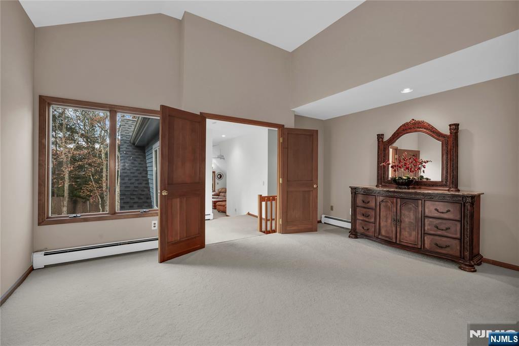 738 Ridge Road Butler, NJ 07405 - Photo 41 of 50 a view of an empty room with a fireplace and a window