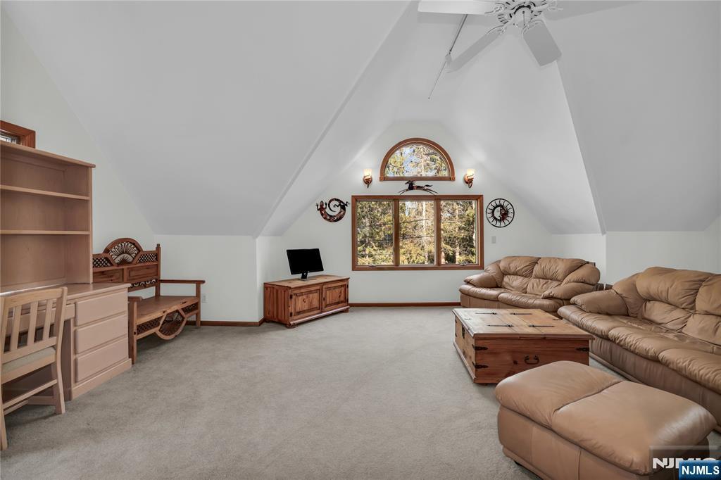 738 Ridge Road Butler, NJ 07405 - Photo 42 of 50 a living room with furniture a rug and a window