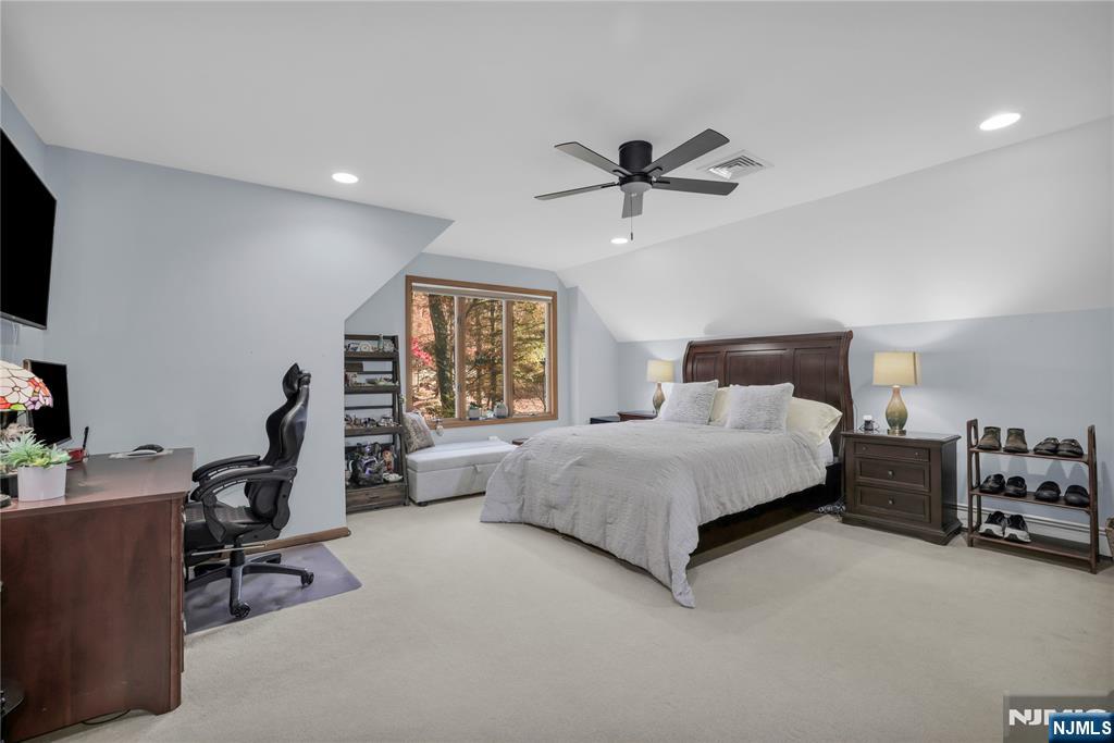 738 Ridge Road Butler, NJ 07405 - Photo 45 of 50 a bedroom with a bed a desk and chair