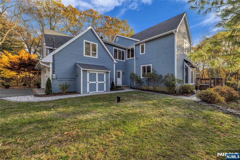 738 Ridge Road Butler, NJ 07405 - Photo 49 of 50 a front view of a house with a yard