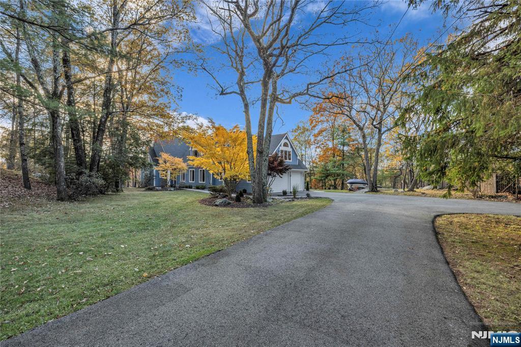 738 Ridge Road Butler, NJ 07405 - Photo 8 of 50 a view of road with large trees