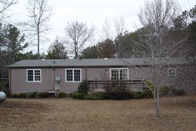 790 Watson Road Forsyth, GA 31029 - Photo 1 of 1 front view of house with a yard