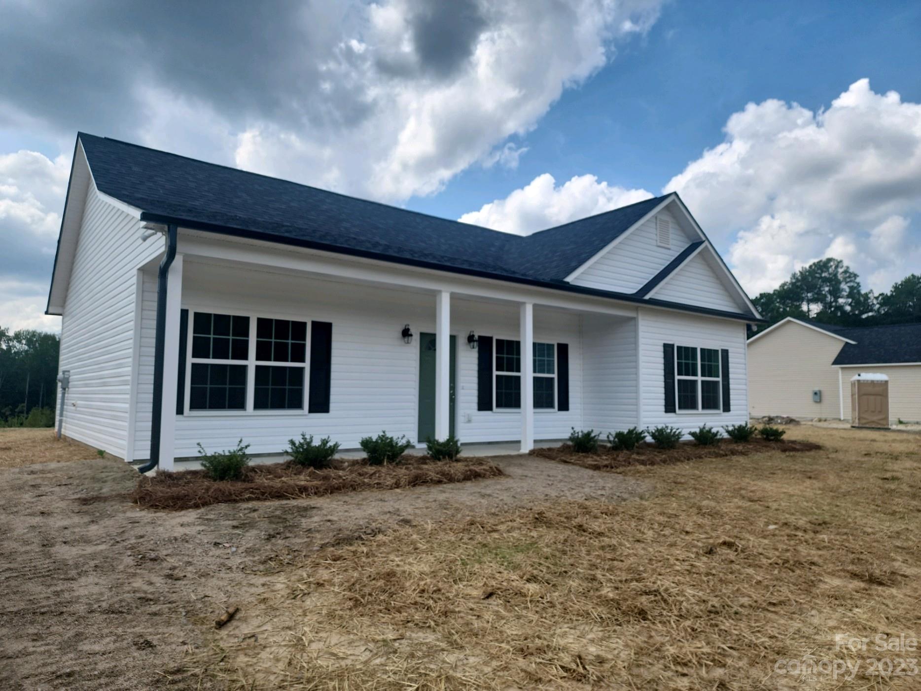 767 Crow Burk Road Pageland, SC 29728 - Photo 2 of 13 a front view of a house with garden