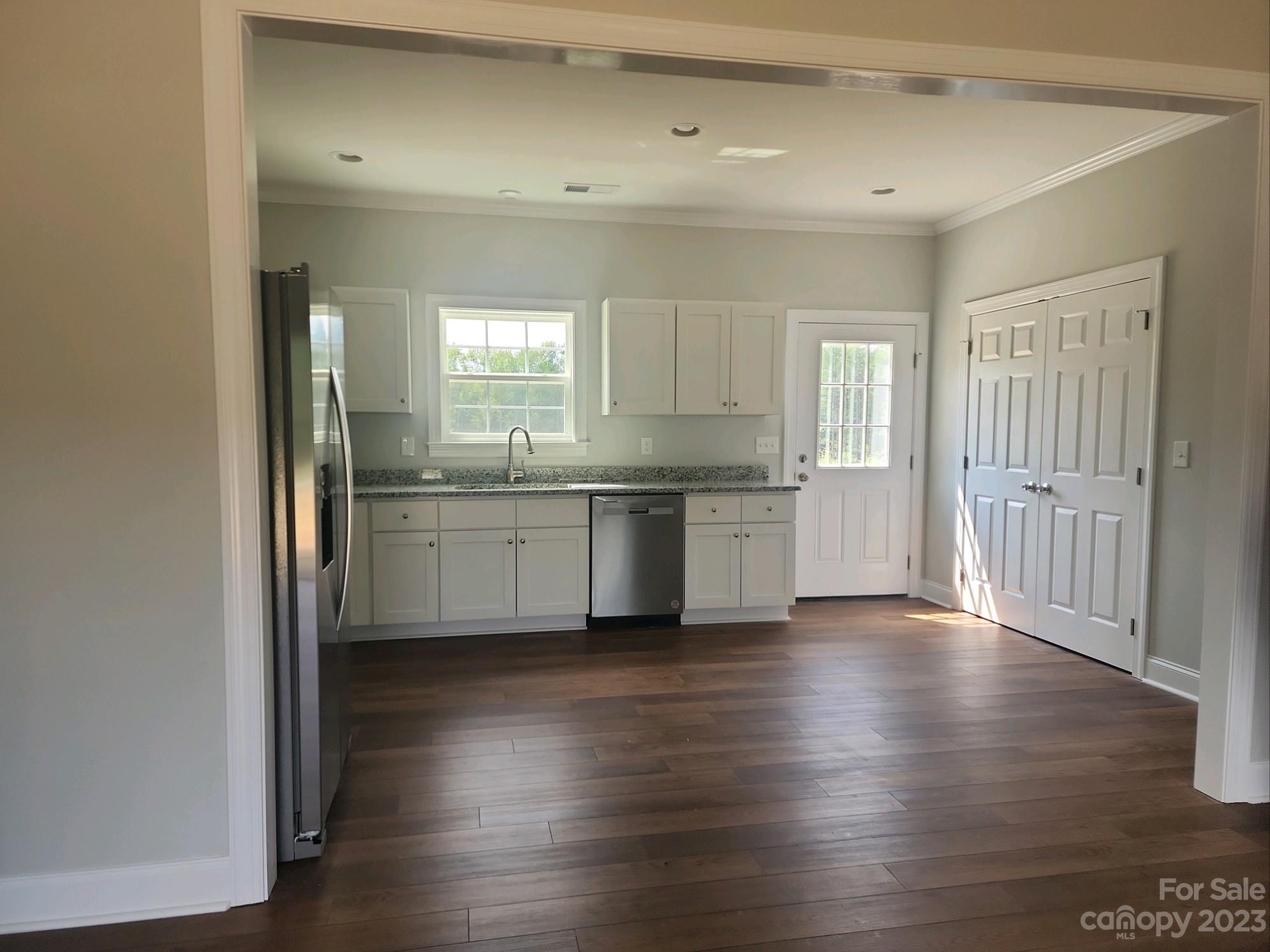 767 Crow Burk Road Pageland, SC 29728 - Photo 5 of 13 a view of a kitchen with a sink cabinets and wooden floor