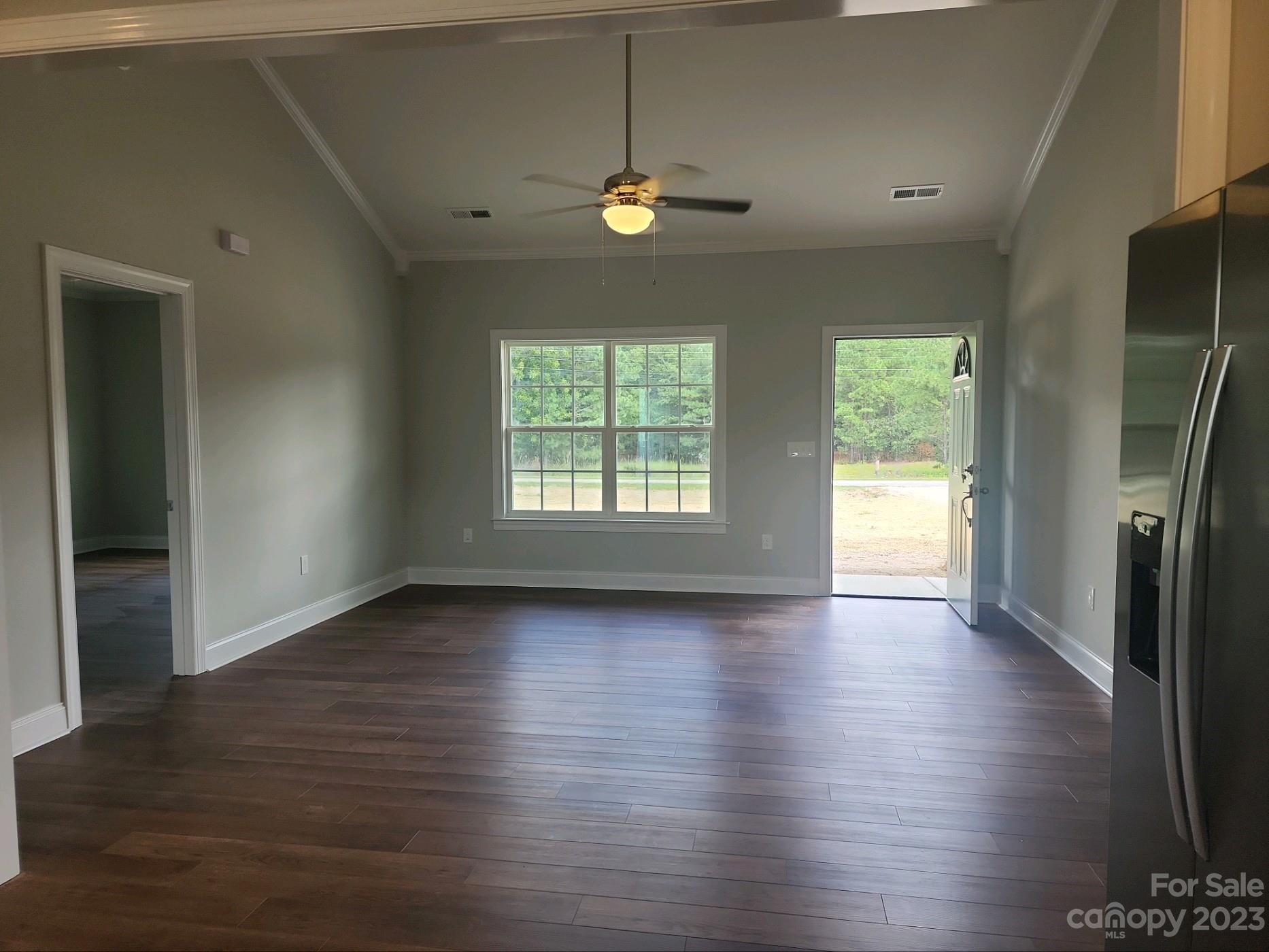767 Crow Burk Road Pageland, SC 29728 - Photo 7 of 13 a view of an empty room with window and wooden floor
