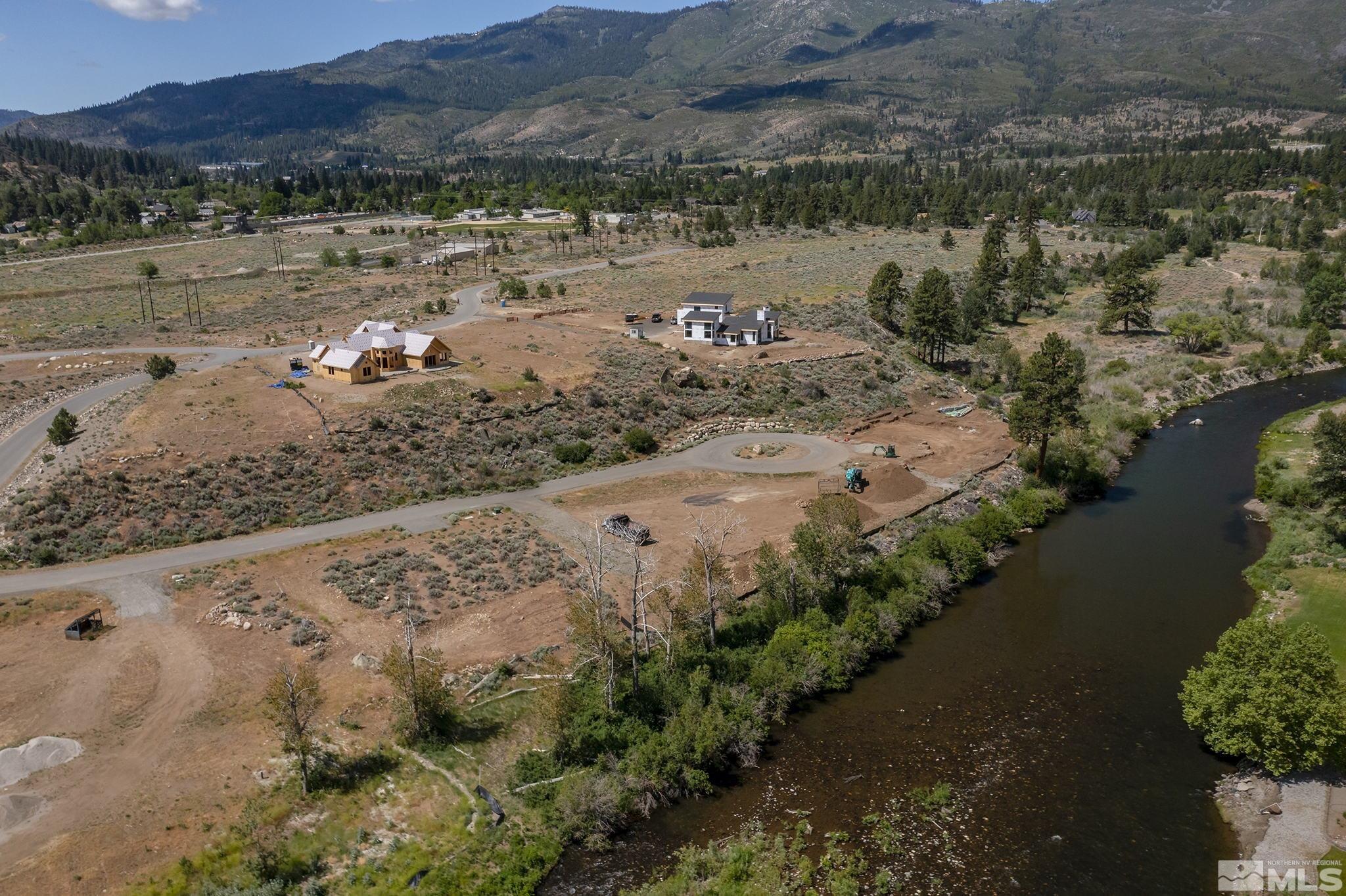 415 River Pines Drive, Unit 7 Reno, NV 89439 - Photo 19 of 27 a view of a lake with beach and outdoor space