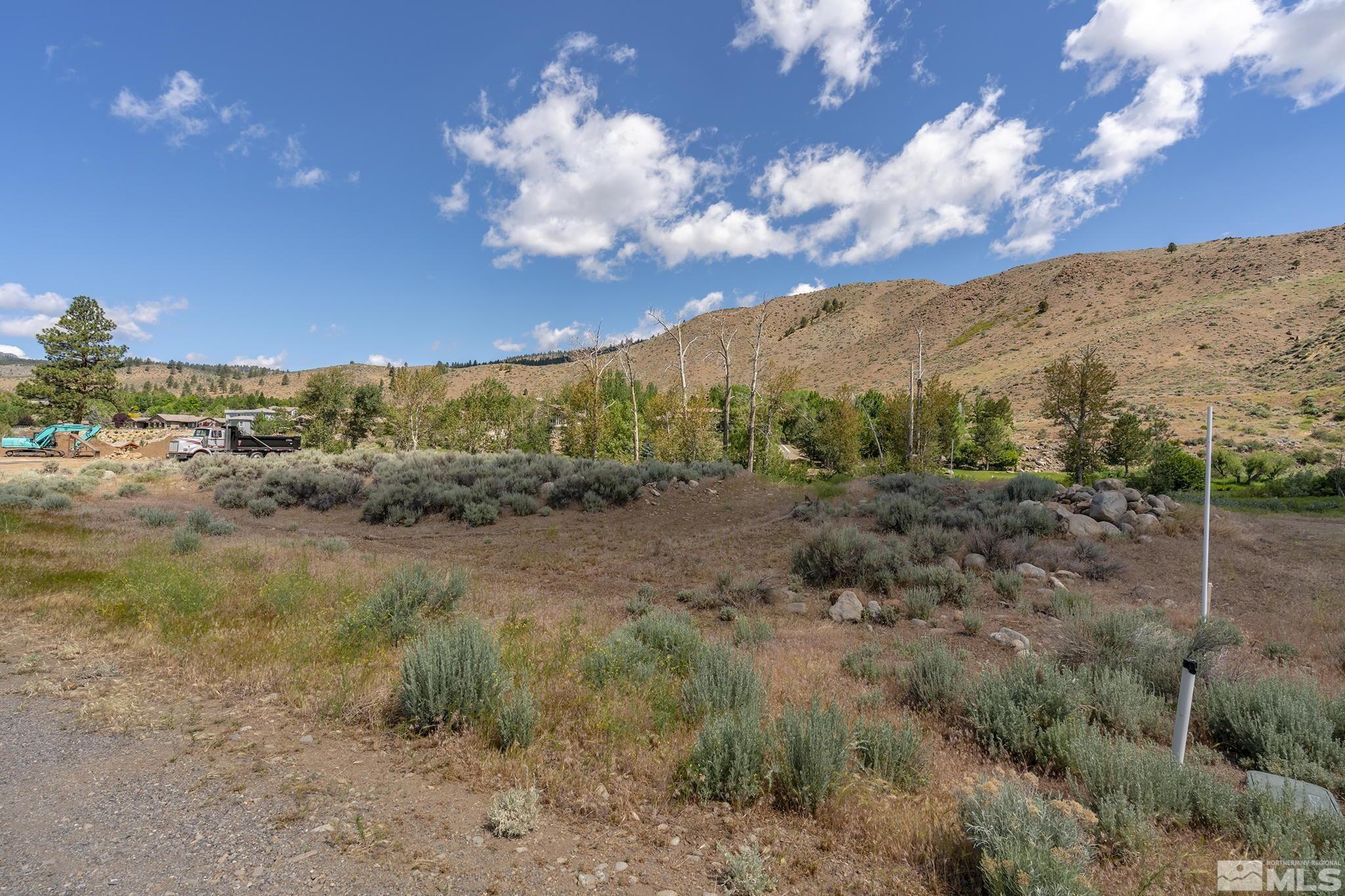415 River Pines Drive, Unit 7 Reno, NV 89439 - Photo 6 of 27 a view of a field with mountains in background