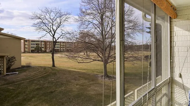 a view of a backyard of the house