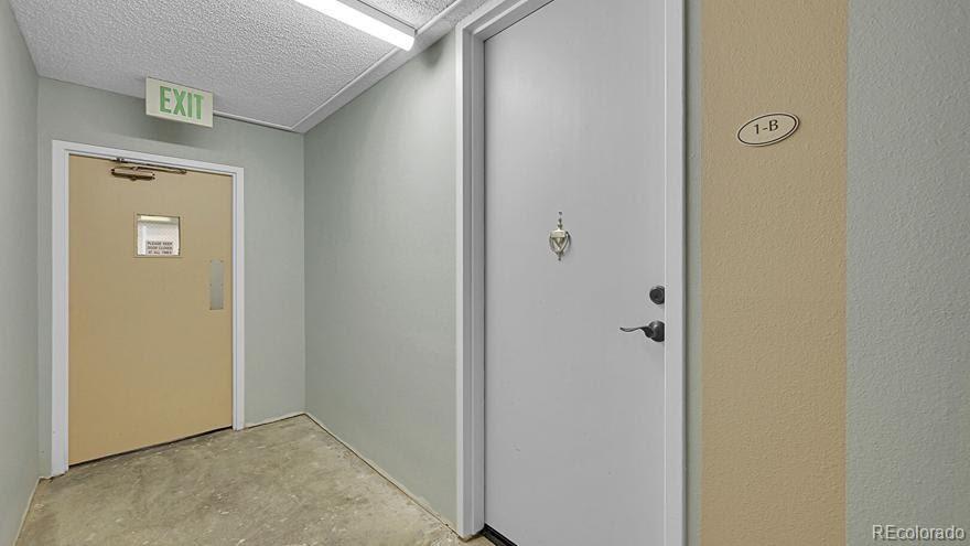 725 South Clinton Street, Unit 1B Denver, CO 80247 - Photo 17 of 22 a view of a hallway with closet