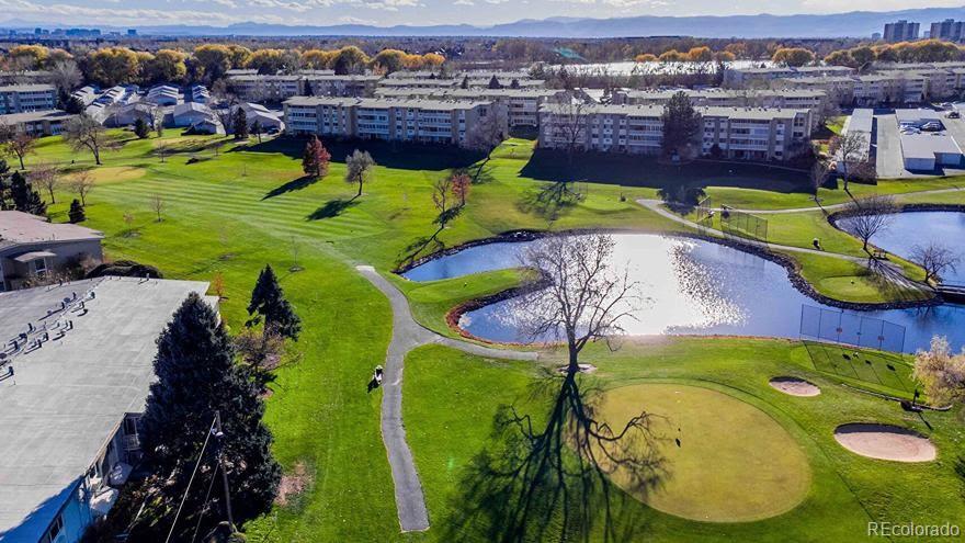 725 South Clinton Street, Unit 1B Denver, CO 80247 - Photo 19 of 22 an aerial view of a swimming pool patio and mountain view