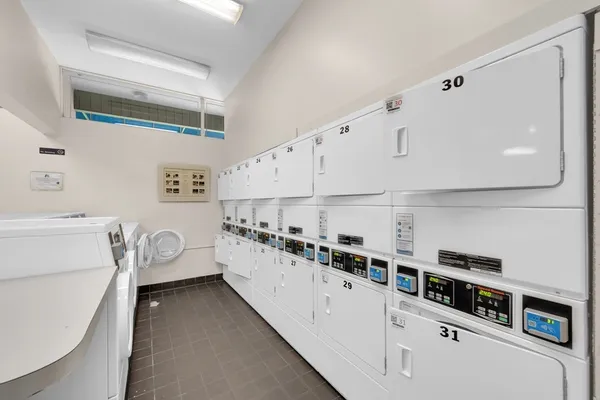 a kitchen with stainless steel appliances a sink and cabinets