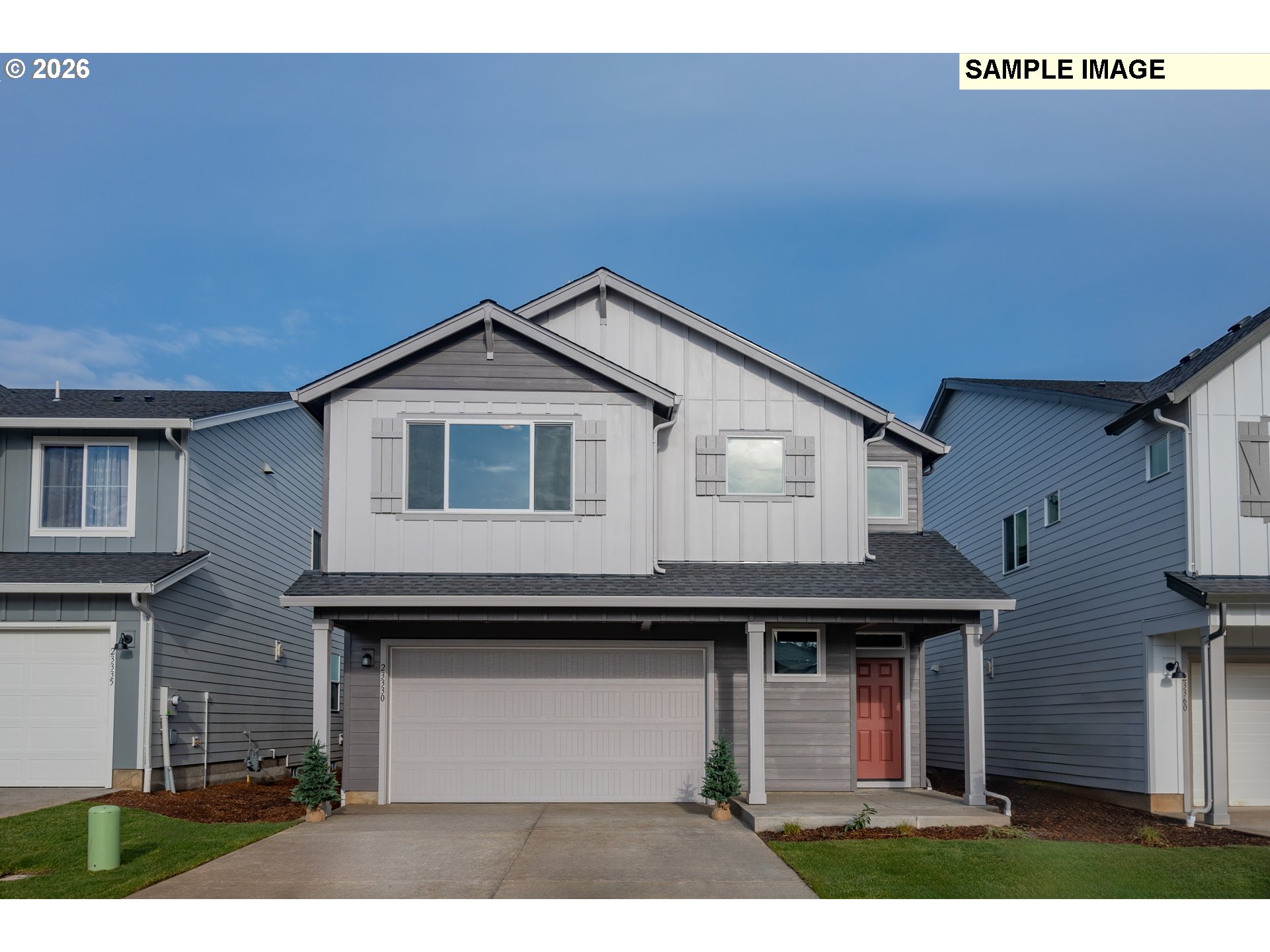 a front view of a house with a garage