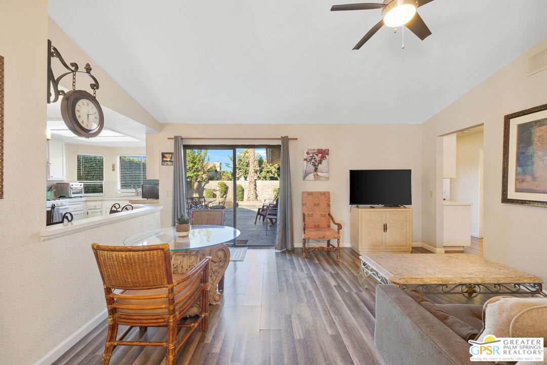 45688 Sutter Creek Road Indio, CA 92201 - Photo 19 of 51 a dining room with furniture and wooden floor