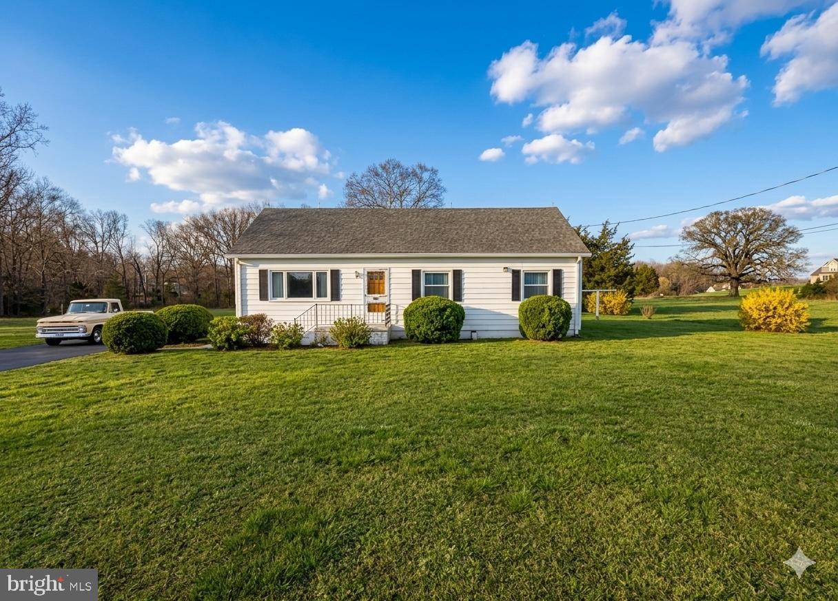 a view of a house with a big yard