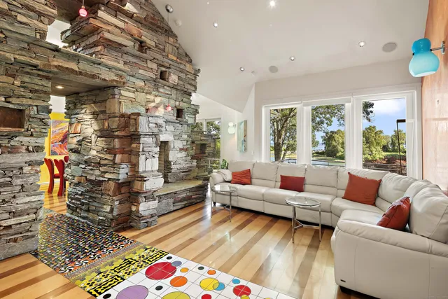 a living room with furniture and a rug