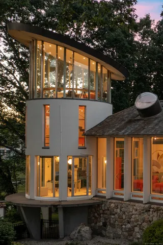 a front view of a house with large windows