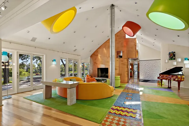 a view of a room with kitchen island dining table and sofas