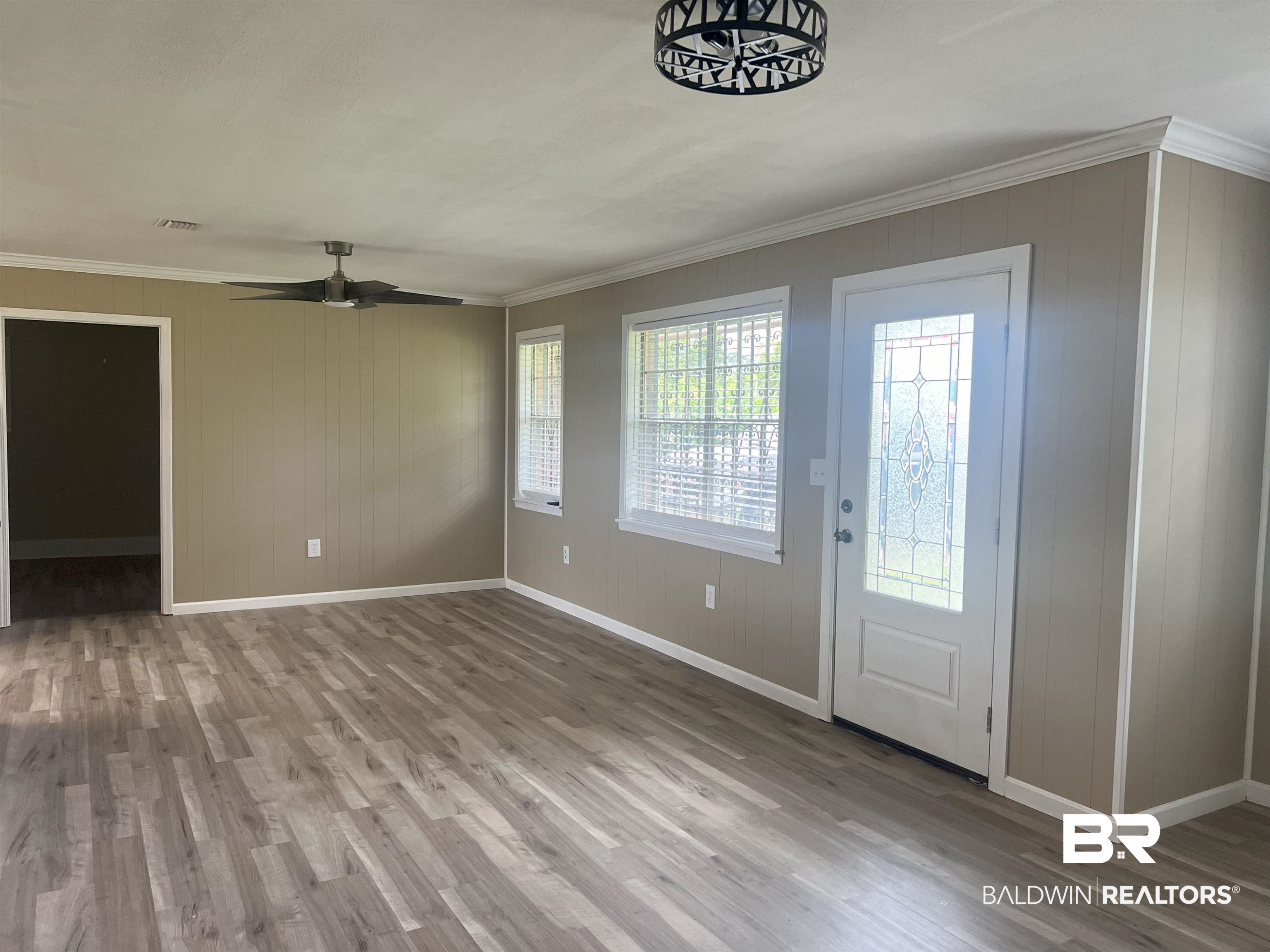 508 Freemanville Drive Atmore, AL 36502 - Photo 7 of 27 Foyer with wood-type flooring, ornamental molding, and ceiling fan