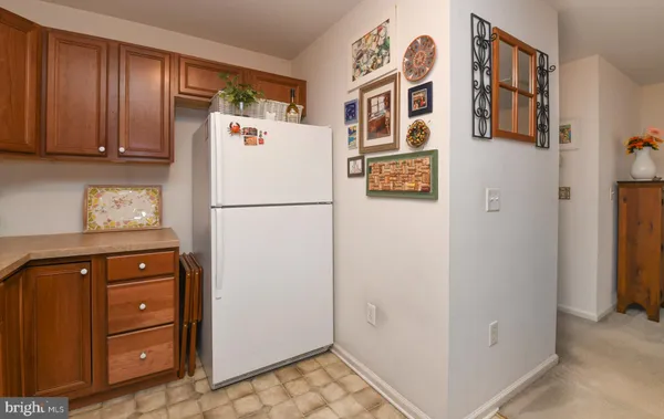 a white refrigerator freezer sitting in a kitchen