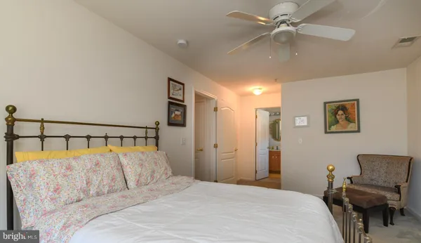 a bedroom with a large bed and furniture