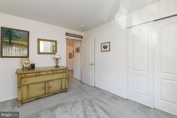 a view of room with window and furniture