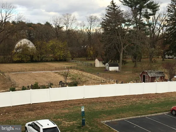 a view of a swimming pool with a yard