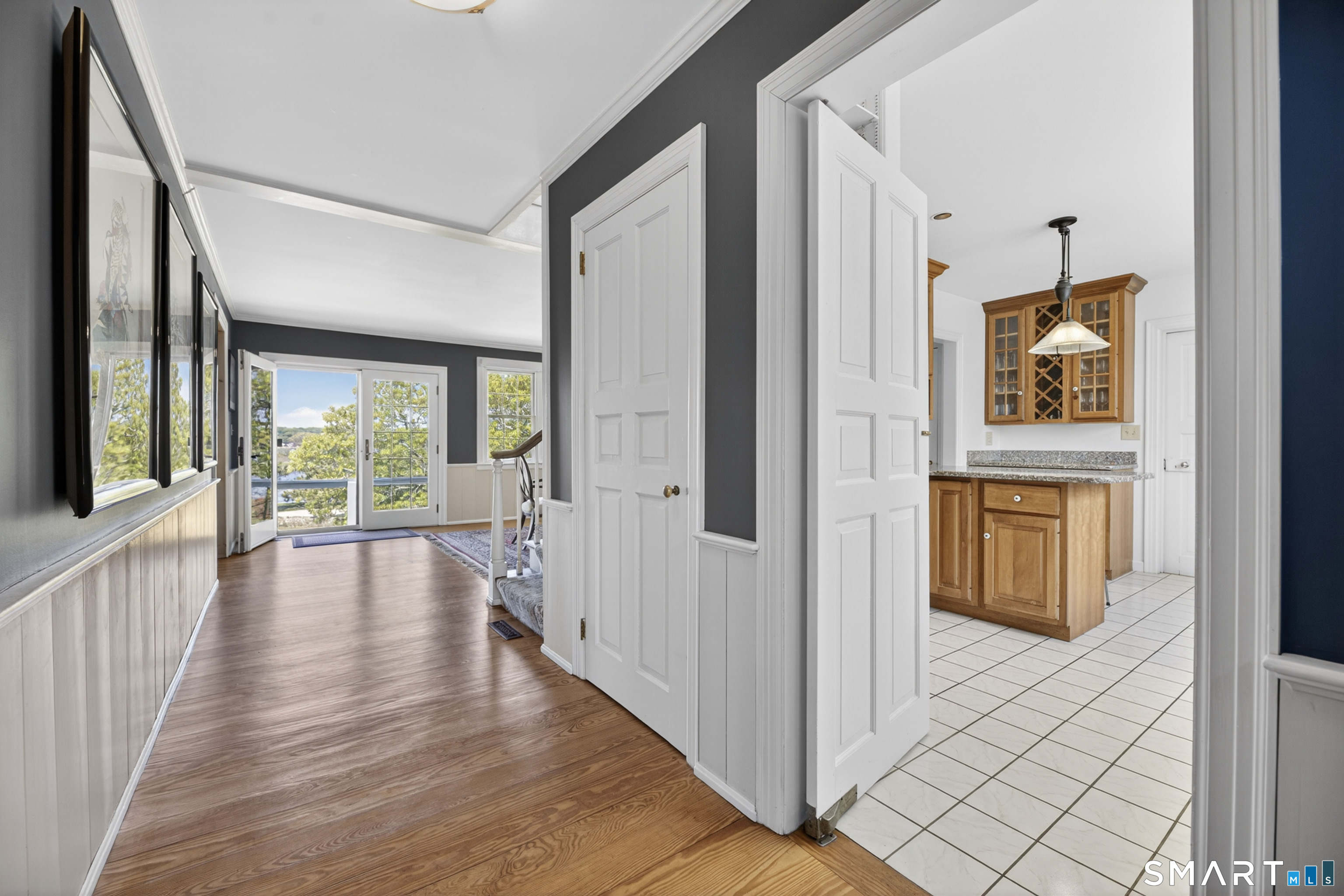 32 Money Point Road Stonington, CT 06355 - Photo 4 of 40 a view of a hallway with wooden floor and windows