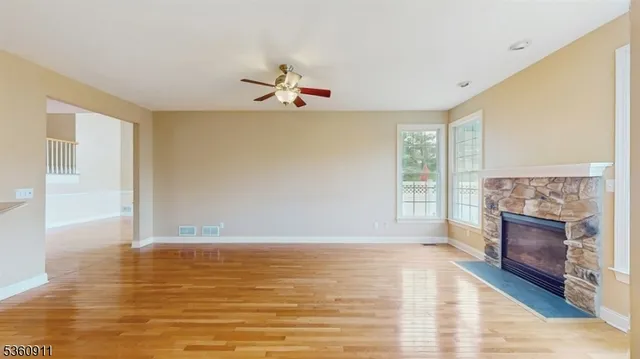 a view of livingroom with hardwood floor and kitchen view