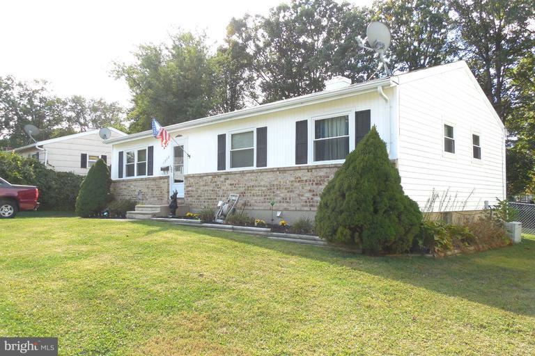 1322 Westburn Road Baltimore, MD 21228 - Photo 1 of 21 a view of a house with a yard