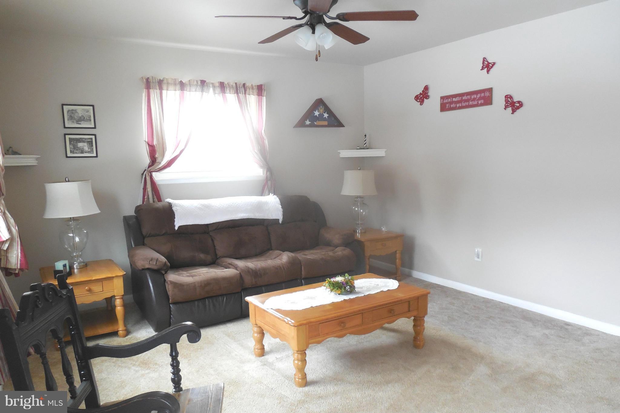 1322 Westburn Road Baltimore, MD 21228 - Photo 11 of 21 a living room with furniture and a window