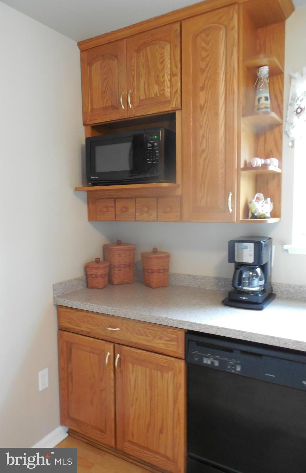 1322 Westburn Road Baltimore, MD 21228 - Photo 13 of 21 a kitchen with stainless steel appliances granite countertop a sink and a microwave