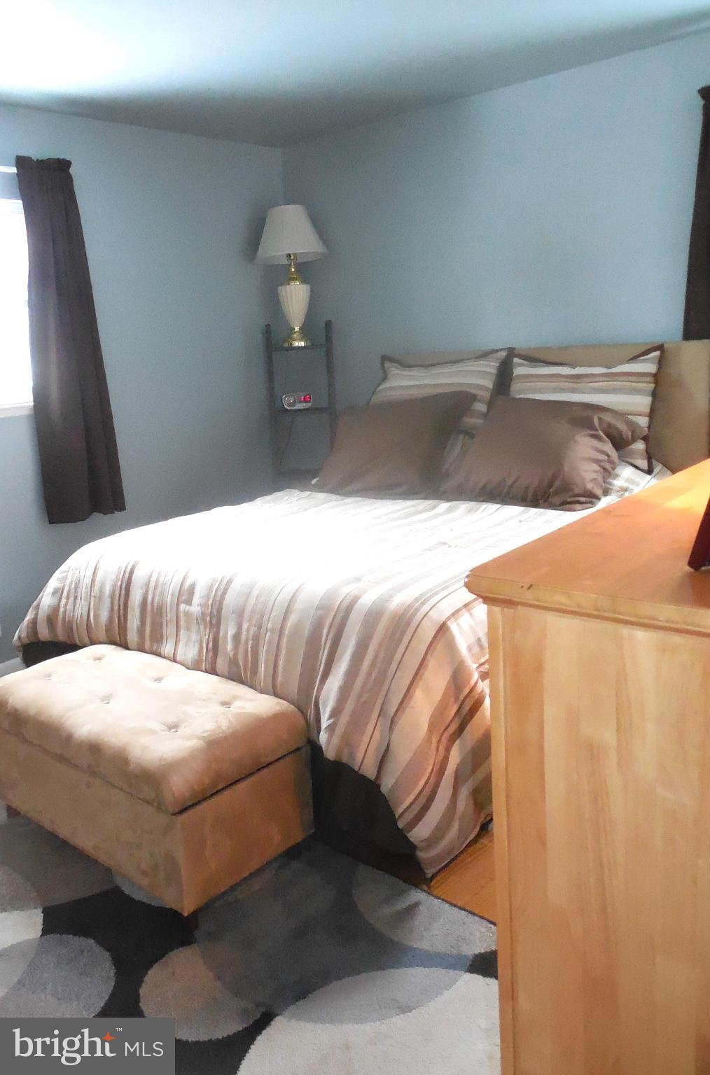 1322 Westburn Road Baltimore, MD 21228 - Photo 16 of 21 a bedroom with a bed and a couch