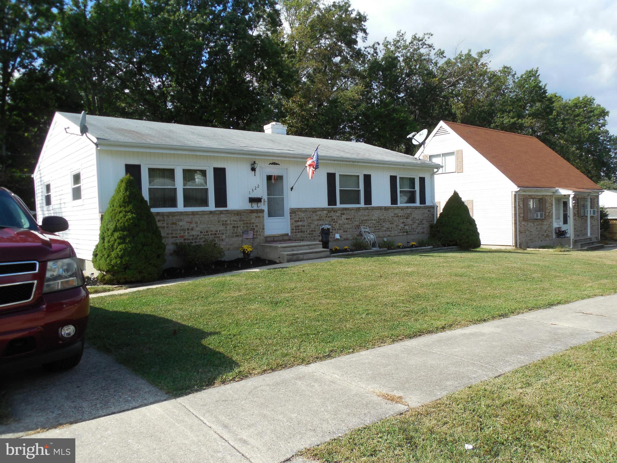 1322 Westburn Road Baltimore, MD 21228 - Photo 5 of 21 a front view of a house with a garden and trees