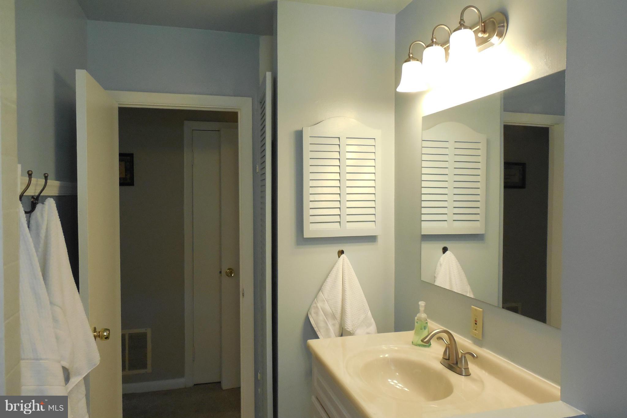 1322 Westburn Road Baltimore, MD 21228 - Photo 7 of 21 a bathroom with a sink and a mirror