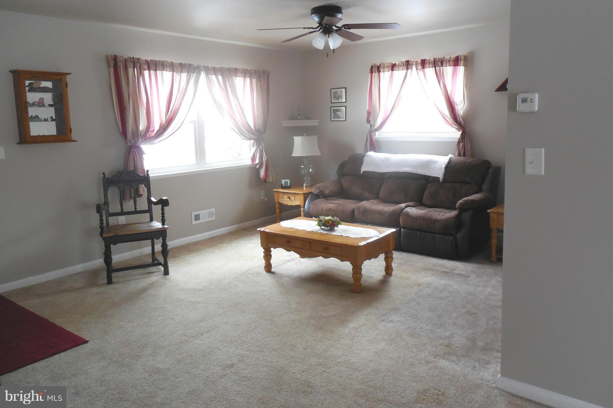 1322 Westburn Road Baltimore, MD 21228 - Photo 10 of 21 a living room with furniture and a window