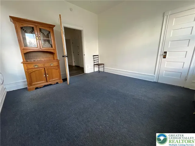 a view of empty room with front door