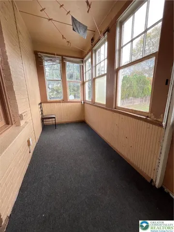 an empty room with windows