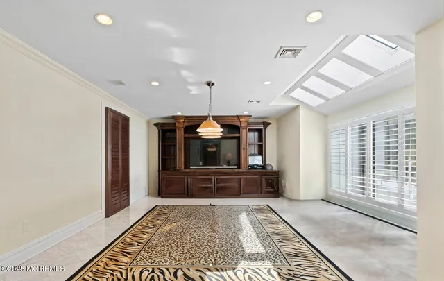 a view of hallway with windows