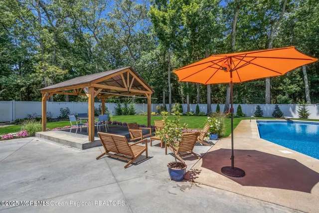 a patio with a table and chairs