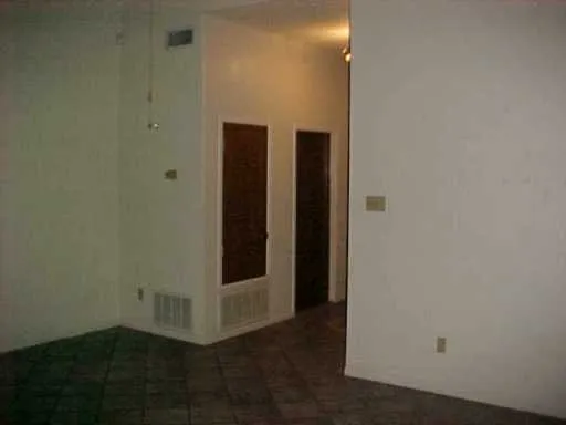 a bathroom with a shower and a sink