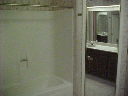 4947 Elm Hurst Lane Corpus Christi, TX 78413 - Photo 10 of 10 a bathroom with a shower and a sink