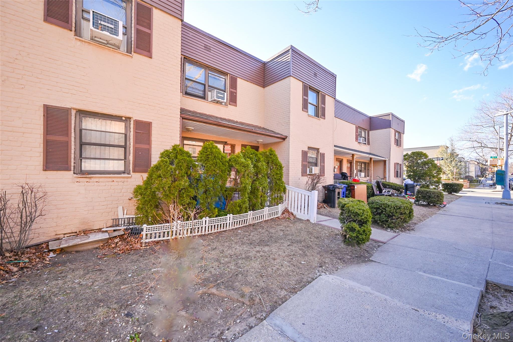 72-08 150th Street, Unit 199B Queens, NY 11367 - Photo 2 of 5 a view of a street with a building