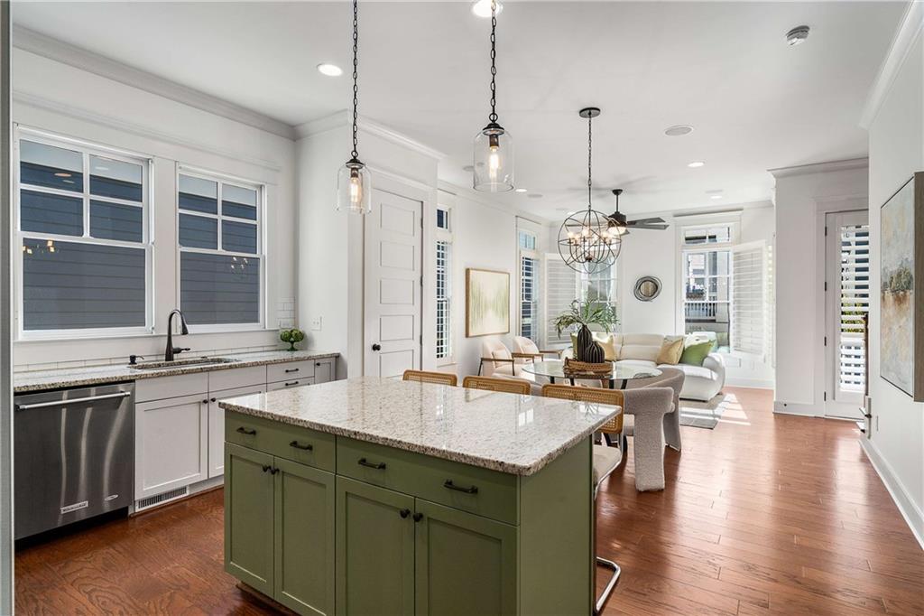 2003 Hibernia Bend Decatur, GA 30030 - Photo 14 of 52 a open kitchen with stainless steel appliances granite countertop a sink dishwasher a stove and a dining table with wooden floor