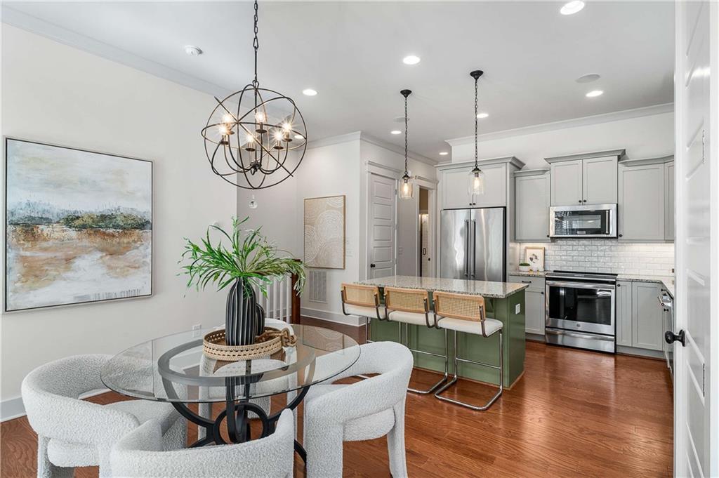 2003 Hibernia Bend Decatur, GA 30030 - Photo 15 of 52 a dining room with furniture a chandelier and wooden floor