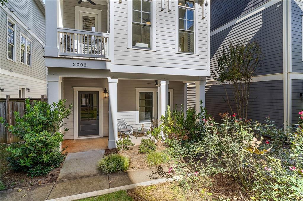 2003 Hibernia Bend Decatur, GA 30030 - Photo 2 of 52 a view of brick house with a large windows and flower plants